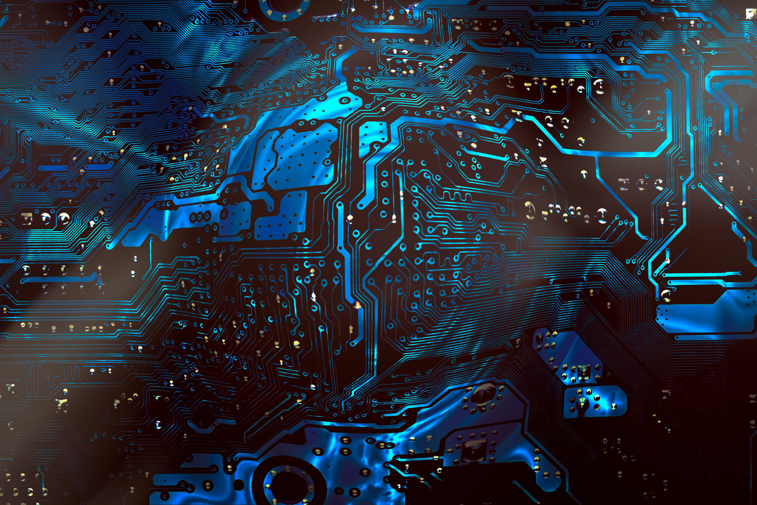 Circuit board background of computer motherboard with magnifier Circuit board background of computer motherboard with magnifier circle at the center and light spots reflections.